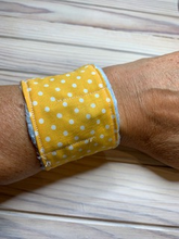 Load image into Gallery viewer, My fidget bracelets have soft fleece on the reverse (ideal for those with sensory issues) and cotton fabric on the top. They are secured with a metal popper.  A small bead is inside that can be pushed around the 'maze' that has been sewn into the bracelet.  These are ideal for fiddling without being too obvious - perfect for anxiety, stress, ASD or boredom.