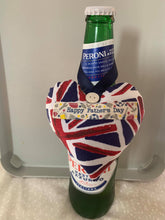Load image into Gallery viewer, A softly padded star or heart with looped ribbon - so perfect for hanging around the bottle of something when gifting.  They can then choose where to hang it afterwards.  Choose your message - 'Dad in a Million', 'Grandad in a Million' or 'Happy Father's Day'  Fabric options are - grey stars, football, Union Jack or rugby - I have many more options so please use the 'Contact Us' page if you would like to discuss these.
