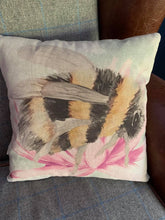 Load image into Gallery viewer, A gorgeous linen/cotton mix cushion with a large bee print on the front, with mini print fabric on the reverse. This measures approx 40x40cm and can be washed (on a hand wash or wool wash) as the covers are zipped and the inner can be removed.
