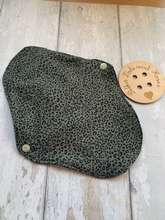 Load image into Gallery viewer, My sanitary towels are made from a top layer of organic cotton jersey that draws the liquid away, the inner core is organic bamboo fleece velour fabric which is highly absorbent, then a layer of PUL which is a breathable waterproof fabric and then of course pretty cotton fabric on the bottom. These high quality, eco friendly fabrics are anti-bacterial, anti-odour and therefore kind to your skin as well as the environment. They are secured with a plastic snap. Washing Instructions - it is best to wash thes