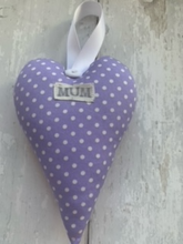 Load image into Gallery viewer, These small hanging hearts are the perfect way to show your love and appreciation to your mum. They look great hung on a wall, door handle or gifted around the neck of a bottle of wine, fizz or bubble bath. They measure approx 13x9cm  Available with any name (hand stamped) and on their own, or in a wicker heart.