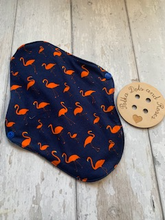 Load image into Gallery viewer, My sanitary towels are made from a top layer of organic cotton jersey that draws the liquid away, the inner core is organic bamboo fleece velour fabric which is highly absorbent, then a layer of PUL which is a breathable waterproof fabric and then of course pretty cotton fabric on the bottom. These high quality, eco friendly fabrics are anti-bacterial, anti-odour and therefore kind to your skin as well as the environment. They are secured with a plastic snap. Washing Instructions - it is best to wash thes