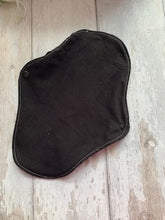 Load image into Gallery viewer, My sanitary towels are made from a top layer of organic cotton jersey that draws the liquid away, the inner core is organic bamboo fleece velour fabric which is highly absorbent, then a layer of PUL which is a breathable waterproof fabric and then of course pretty cotton fabric on the bottom. These high quality, eco friendly fabrics are anti-bacterial, anti-odour and therefore kind to your skin as well as the environment. They are secured with a plastic snap. Washing Instructions - it is best to wash thes