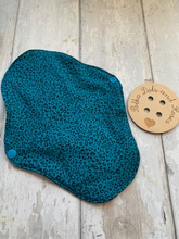 Load image into Gallery viewer, My sanitary towels are made from a top layer of organic cotton jersey that draws the liquid away, the inner core is organic bamboo fleece velour fabric which is highly absorbent, then a layer of PUL which is a breathable waterproof fabric and then of course pretty cotton fabric on the bottom. These high quality, eco friendly fabrics are anti-bacterial, anti-odour and therefore kind to your skin as well as the environment. They are secured with a plastic snap. Washing Instructions - it is best to wash thes