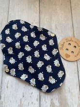 Load image into Gallery viewer, My sanitary towels are made from a top layer of organic cotton jersey that draws the liquid away, the inner core is organic bamboo fleece velour fabric which is highly absorbent, then a layer of PUL which is a breathable waterproof fabric and then of course pretty cotton fabric on the bottom. These high quality, eco friendly fabrics are anti-bacterial, anti-odour and therefore kind to your skin as well as the environment. They are secured with a plastic snap. Washing Instructions - it is best to wash thes