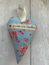 Load image into Gallery viewer, These small hanging hearts are the perfect way to show your love and appreciation to your mum. They look great hung on a wall, door handle or gifted around the neck of a bottle of wine, fizz or bubble bath. They measure approx 13x9cm  Available with any name (hand stamped) and on their own, or in a wicker heart.