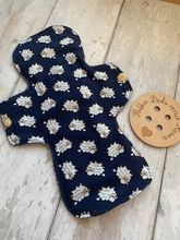 Load image into Gallery viewer, My sanitary towels are made from a top layer of organic cotton jersey that draws the liquid away, the inner core is organic bamboo fleece velour fabric which is highly absorbent, then a layer of PUL which is a breathable waterproof fabric and then of course pretty cotton fabric on the bottom. These high quality, eco friendly fabrics are anti-bacterial, anti-odour and therefore kind to your skin as well as the environment. They are secured with a plastic snap. Washing Instructions - it is best to wash thes