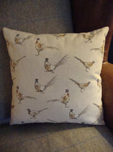 Load image into Gallery viewer, A gorgeous linen/cotton mix cushion with a large bee print on the front, with mini print fabric on the reverse. This measures approx 40x40cm and can be washed (on a hand wash or wool wash) as the covers are zipped and the inner can be removed.
