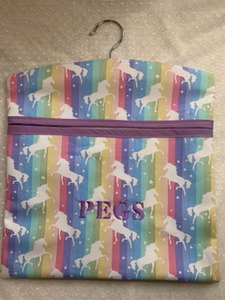 My peg bags are made from good quality fabric and have a large open pocket at the front that is strengthened with bias binding. The wooden hanger can swivel so you can hang the bag wherever you need to.  They measure approx. 32 x 30cm so can fit plenty of pegs in.