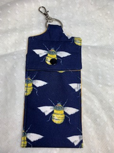 Load image into Gallery viewer, These hand sanitiser anti-bacterial gel holders come with a key ring and lobster clasp so they can be attached to your lanyard, hand bag or belt loop so they are always to hand (no pun intended!) lined with a matching/funky cotton fabric.  They measure approximately 7cm x 14cm and are designed so most 50ml gel bottles fit inside.  They are available with or without the gel included.
